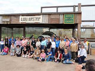 Group photo in front of a D18 Twin Beechcraft African bushplane at Columbus Zoo