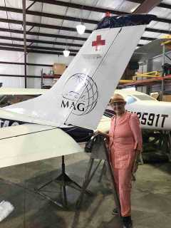A 99 looking at a missionary airplane undergoing maintenance in the shop